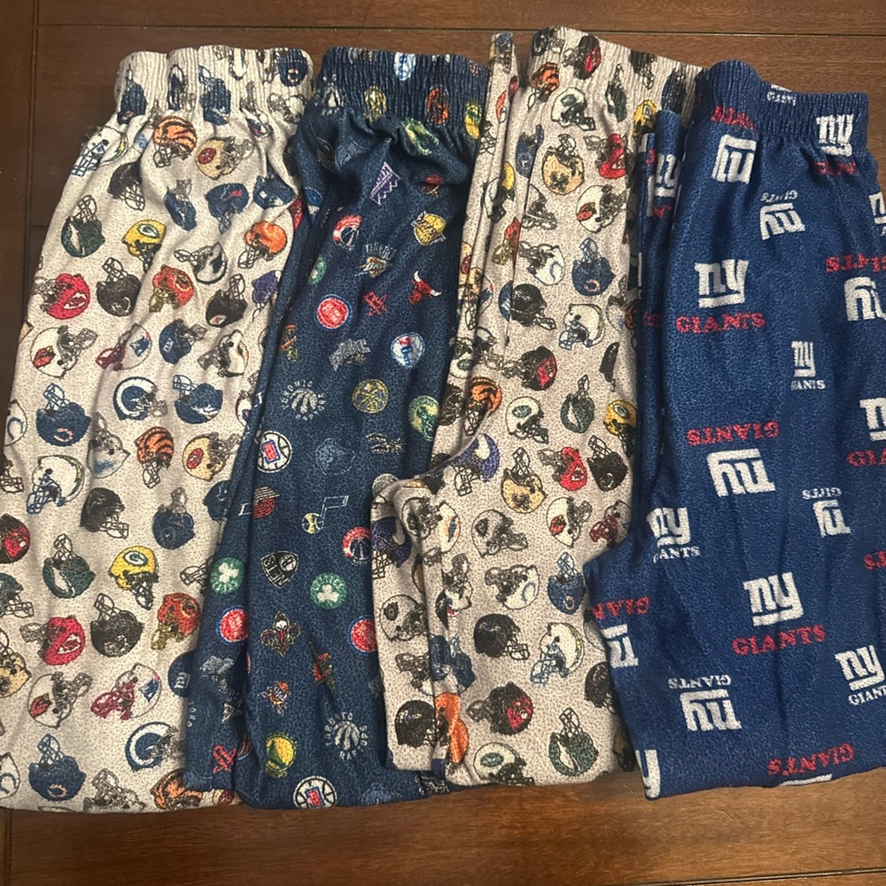 4 pairs of pjs pants 8/10 med boys. football, bball and giants